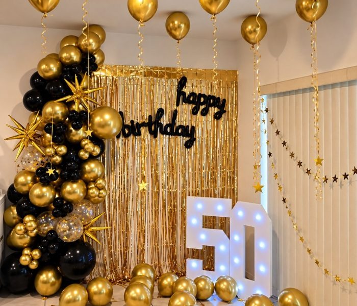 black-gold-50th Black and gold 50th birthday balloon setup with light-up marquee numbers by Pop The Room Balloon Decor
